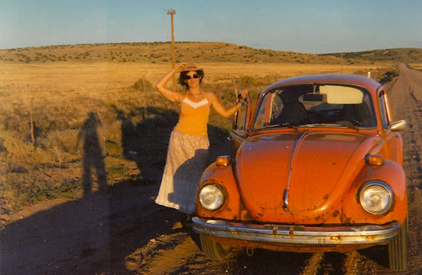 Barbara Golden and her orange VW Beetle, en route to Mills College in 1979. Somewhere in Arizona.